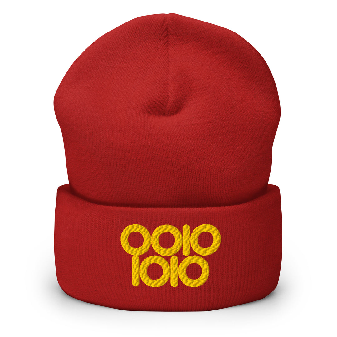 Red beanie embroidered with “0010 1010” in gold thread, a binary 42 design styled with circular ring zeros.