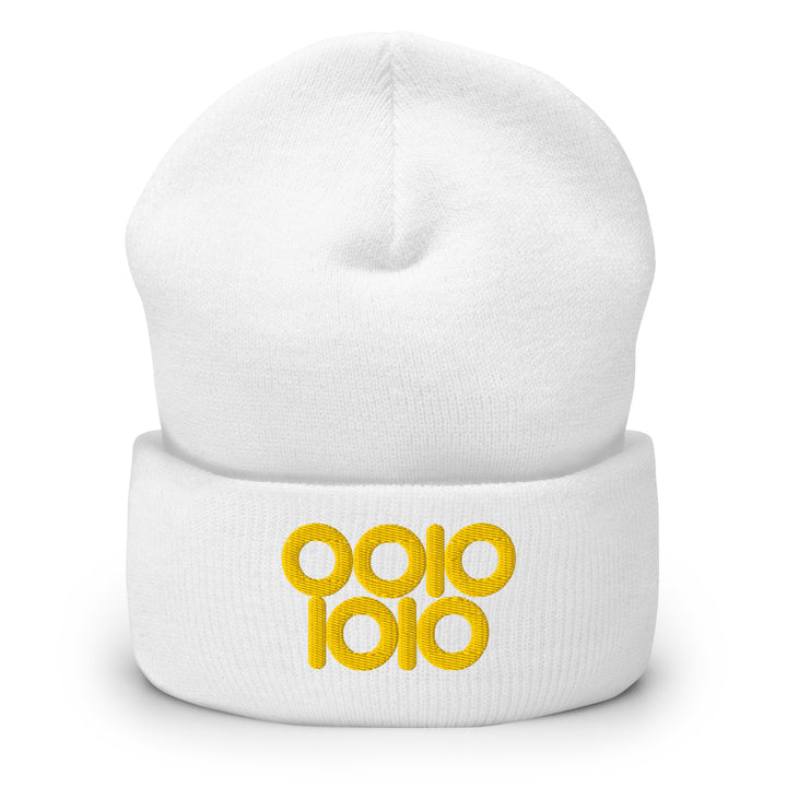 White beanie embroidered with “0010 1010” in gold thread, a binary 42 design featuring rounded ring zeros.