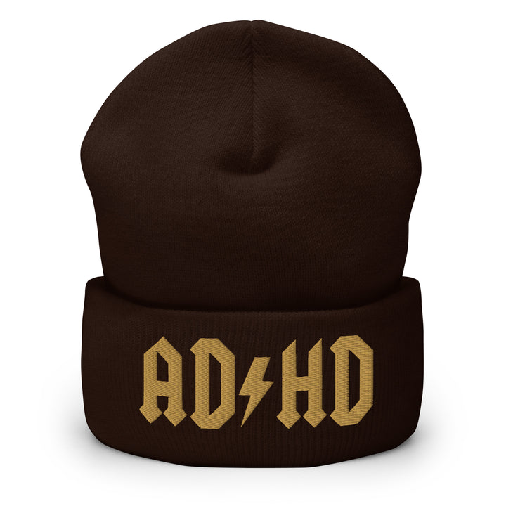 Brown cuffed beanie embroidered with the AD-HD lightning bolt design in old gold, inspired by classic rock iconography and high-voltage energy.