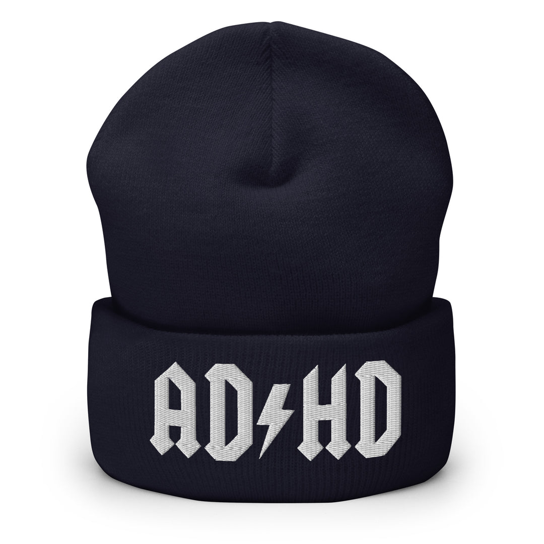 Navy blue cuffed beanie embroidered with the AD-HD lightning bolt design in white, inspired by classic rock iconography and high-voltage energy.