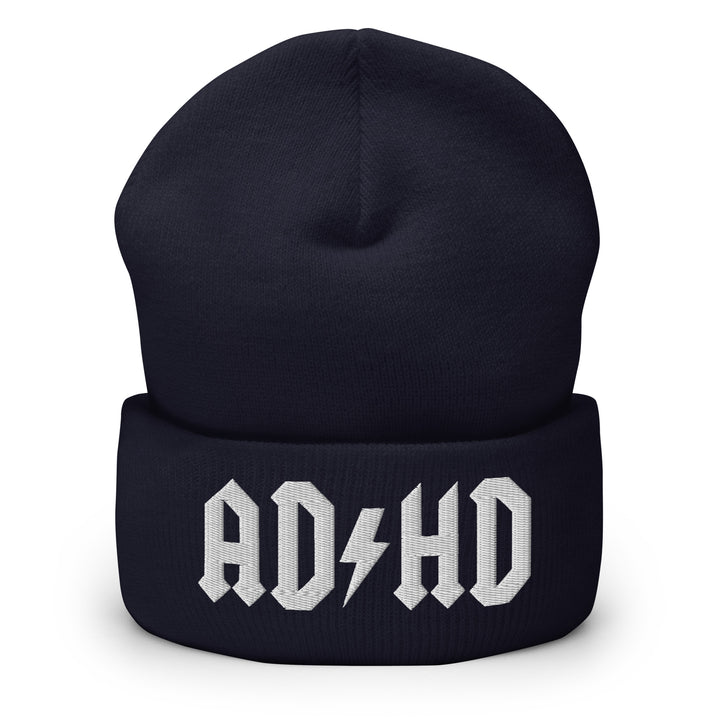 Navy blue cuffed beanie embroidered with the AD-HD lightning bolt design in white, inspired by classic rock iconography and high-voltage energy.