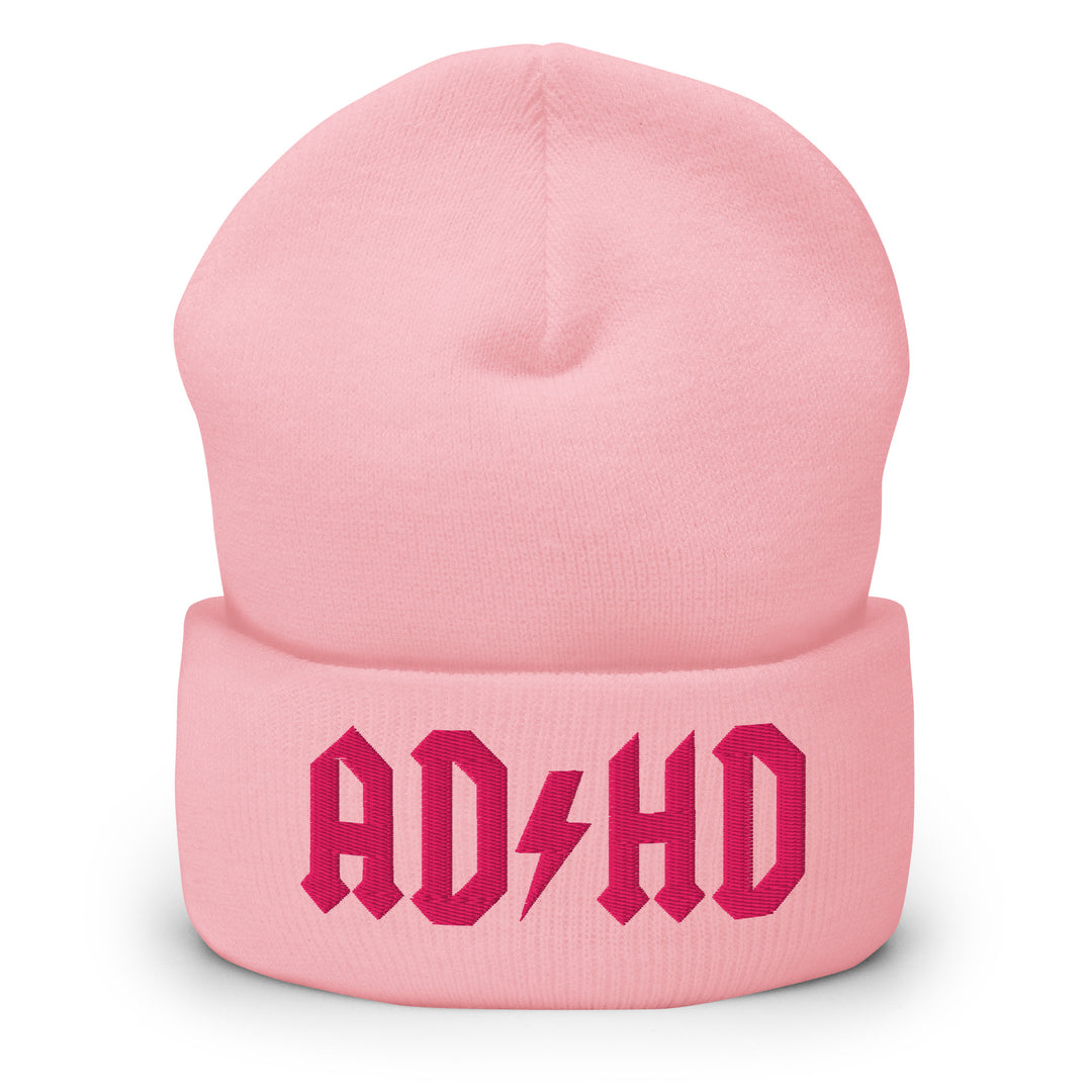 Pink cuffed beanie embroidered with the AD-HD lightning bolt design, inspired by classic rock iconography and high-voltage energy.