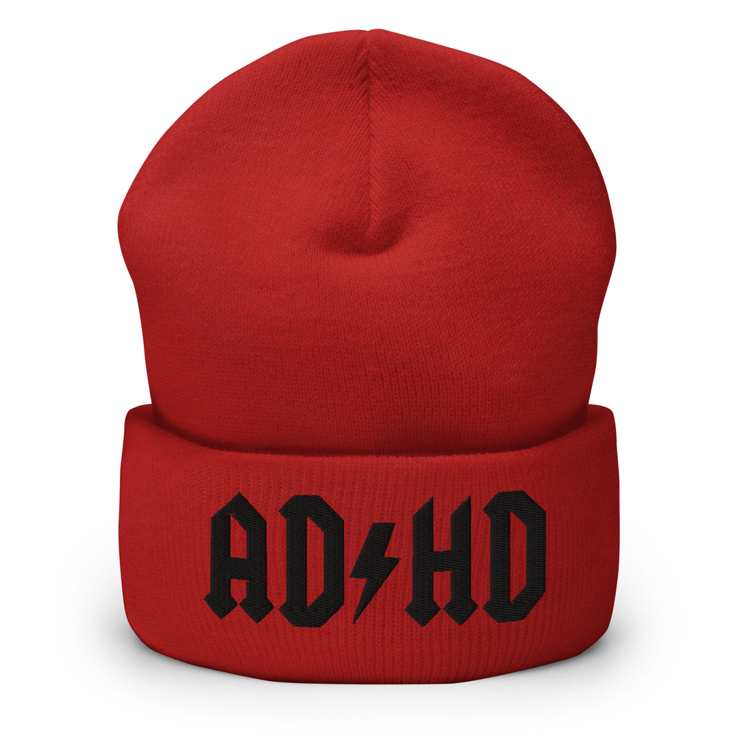 Red cuffed beanie embroidered with the AD-HD lightning bolt design in black, inspired by classic rock iconography and high-voltage energy.