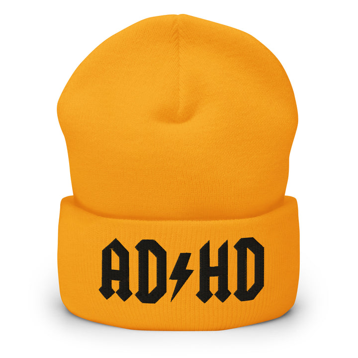 Yellow cuffed beanie embroidered with the AD-HD lightning bolt design in black, inspired by classic rock iconography and high-voltage energy.