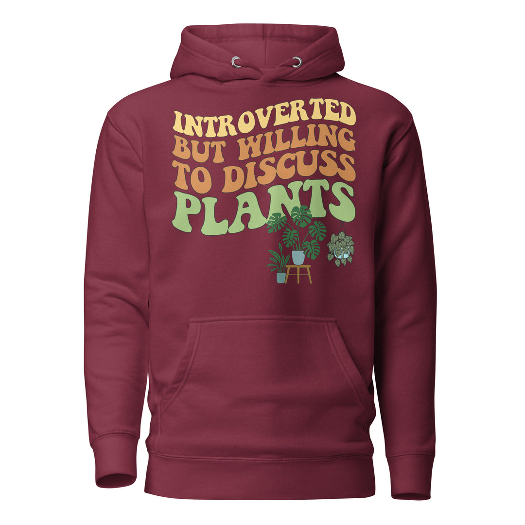 Front view of the maroon “Introverted but Willing to Discuss Plants” hoodie with retro lettering and illustrated houseplants.