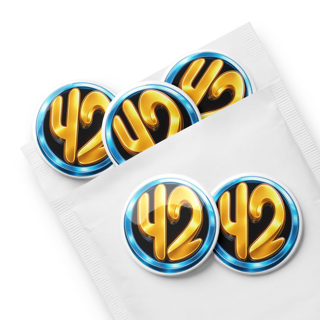 Set of five 42 Circle 2.25" pin buttons featuring a gold “42” inside a blue ring on a black background, displayed partially inside a white envelope sleeve with glossy finish.