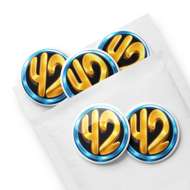 Set of five 42 Circle 2.25" pin buttons featuring a gold “42” inside a blue ring on a black background, displayed partially inside a white envelope sleeve with glossy finish.