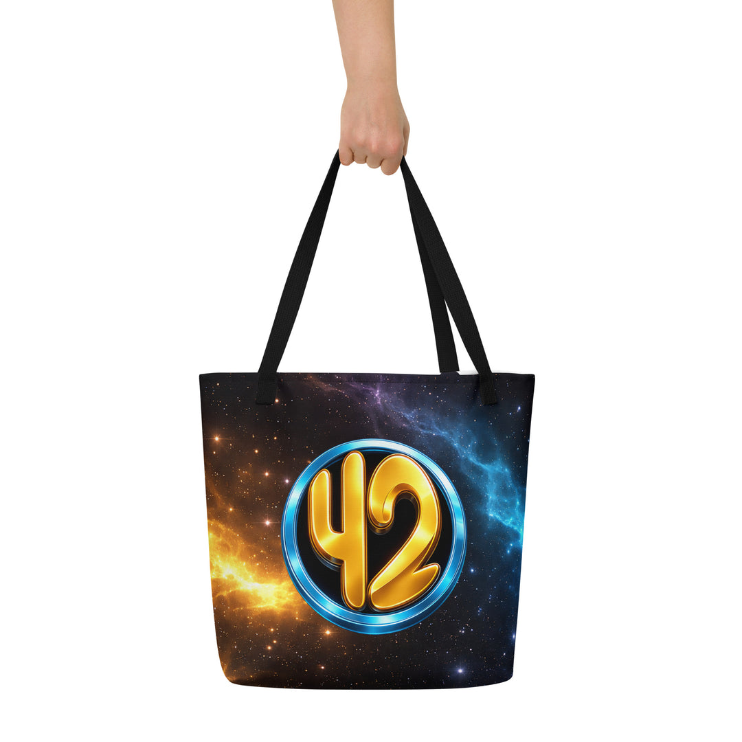 Front view of the Keep It Geek 42 cosmic tote bag with black handles, featuring a glowing gold “42” inside a metallic blue circle against a vibrant nebula starfield design.