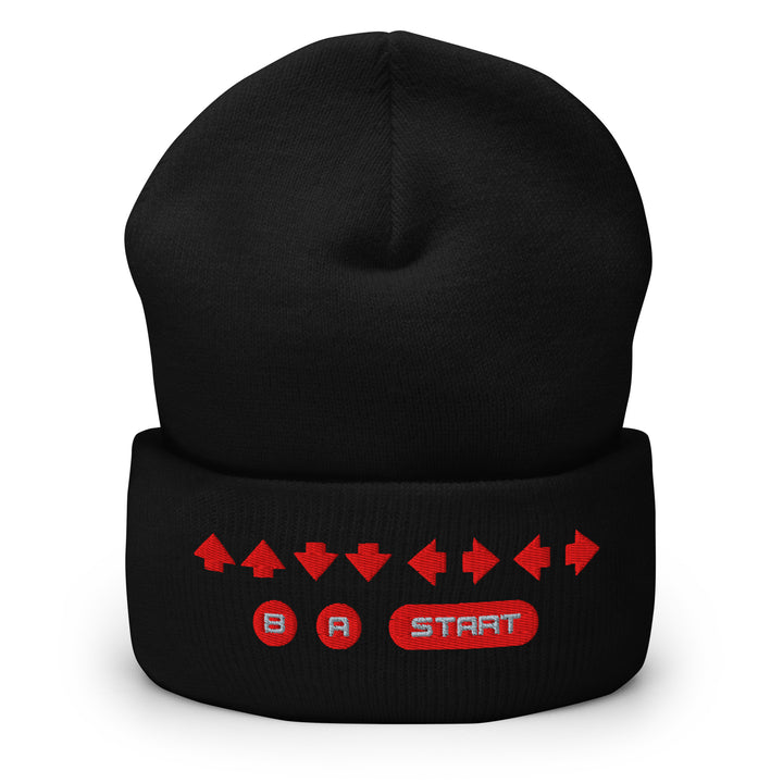 Front view of a black cuffed beanie with embroidered retro cheat code arrow sequence and B, A, START icons across the cuff.