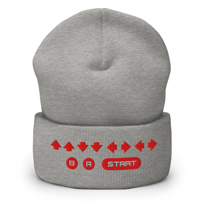 Front view of a heather gray cuffed beanie with embroidered retro cheat code arrows and B, A, START symbols on the cuff.