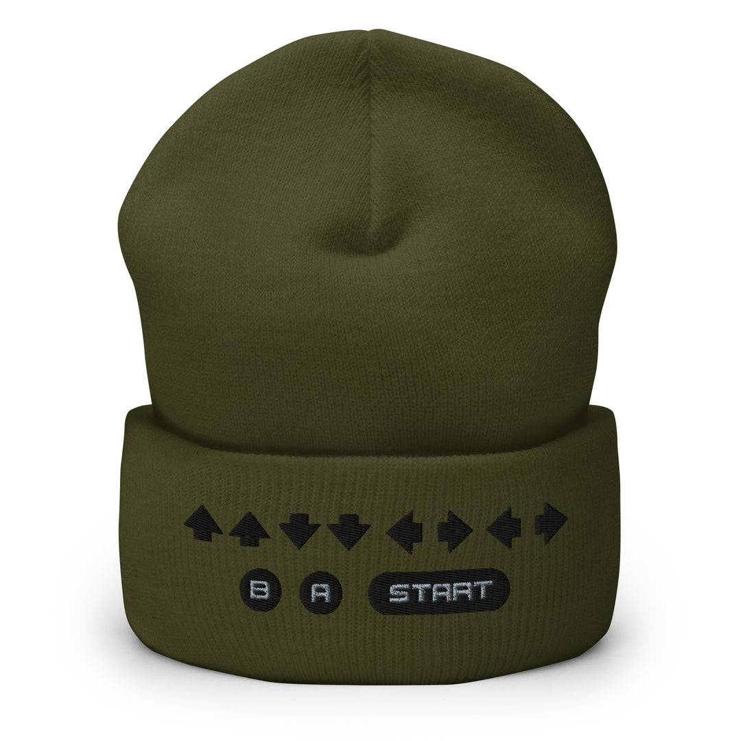 Front view of an olive cuffed beanie featuring embroidered retro cheat code arrows with B, A, and START icons across the folded cuff.