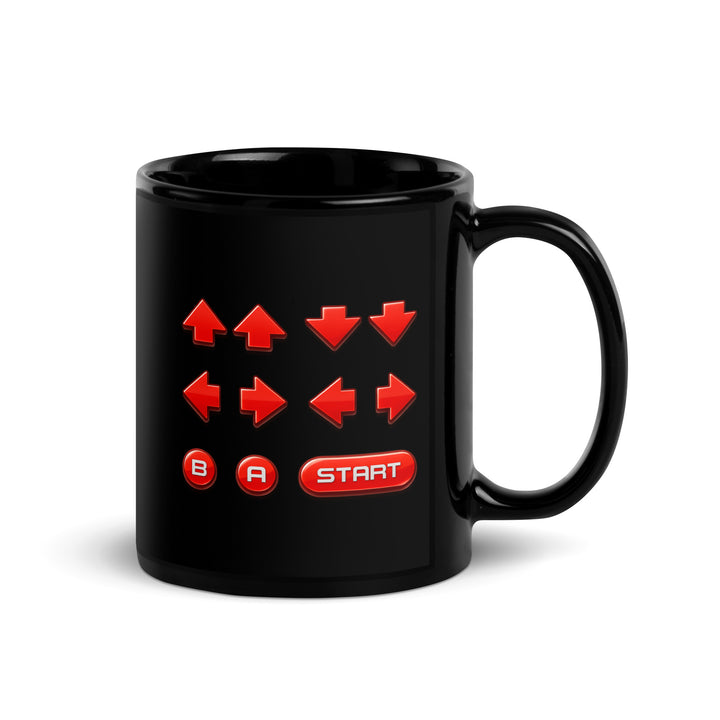 Left-side view of an 11 oz black ceramic mug featuring a retro cheat code button sequence with red directional arrows, B and A buttons, and a Start button.