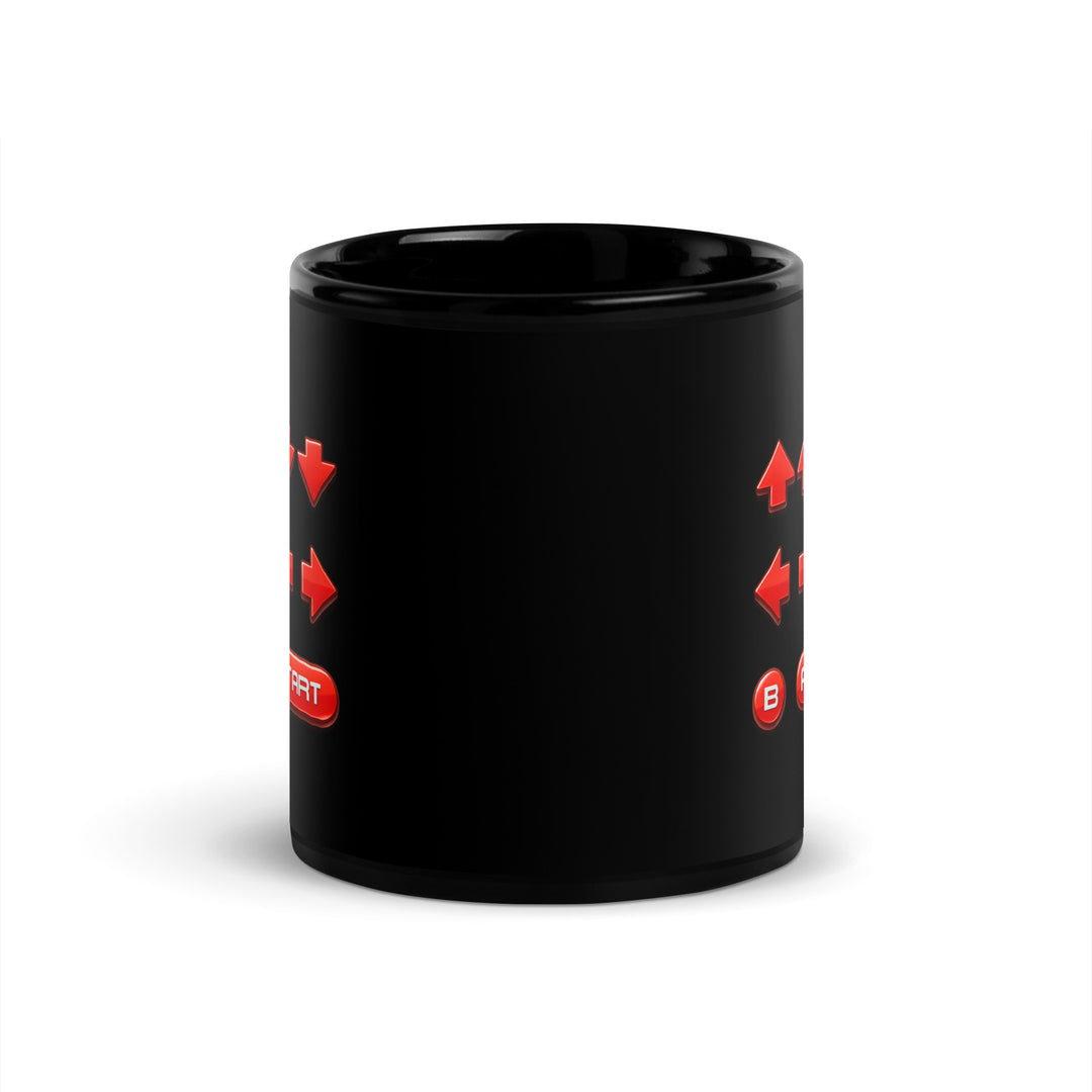 Opposite-handle view of an 11 oz black ceramic mug showing the retro cheat code design wrapping across both sides of the mug.