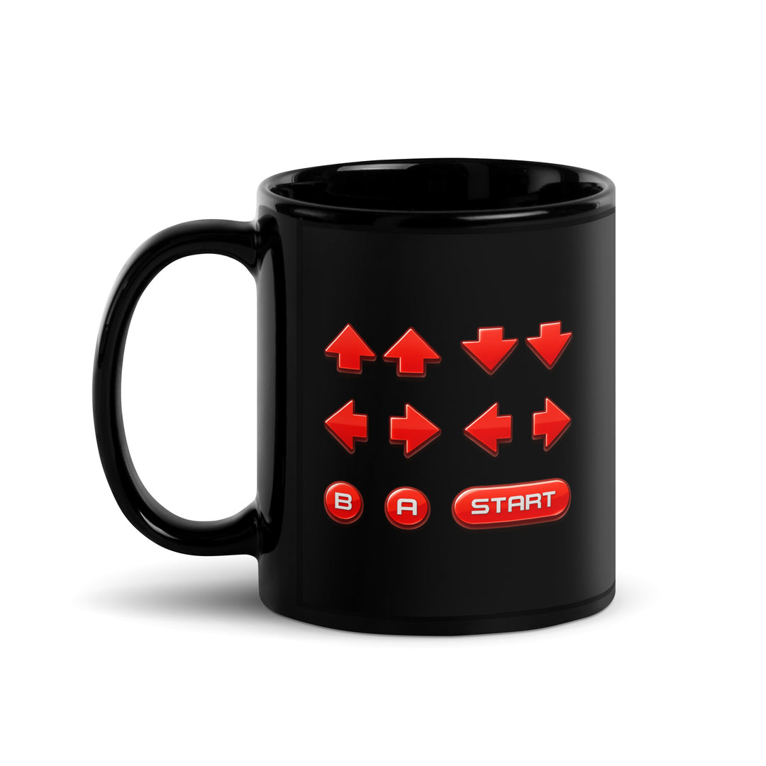 Right-side view of an 11 oz black ceramic mug featuring a retro cheat code button sequence with red directional arrows, B and A buttons, and a Start button.
