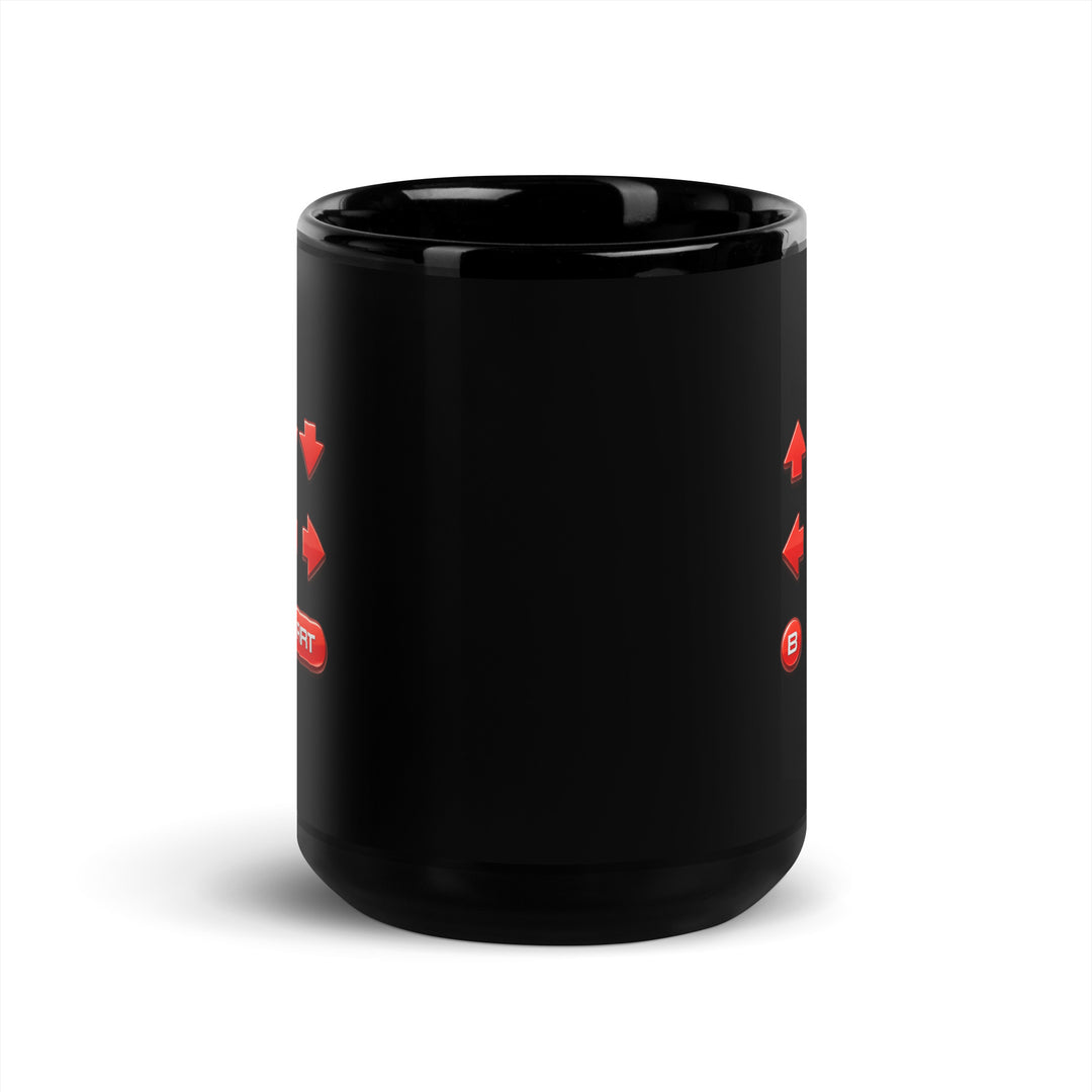 Opposite-handle view of an 15 oz black ceramic mug showing the retro cheat code design wrapping across both sides of the mug.