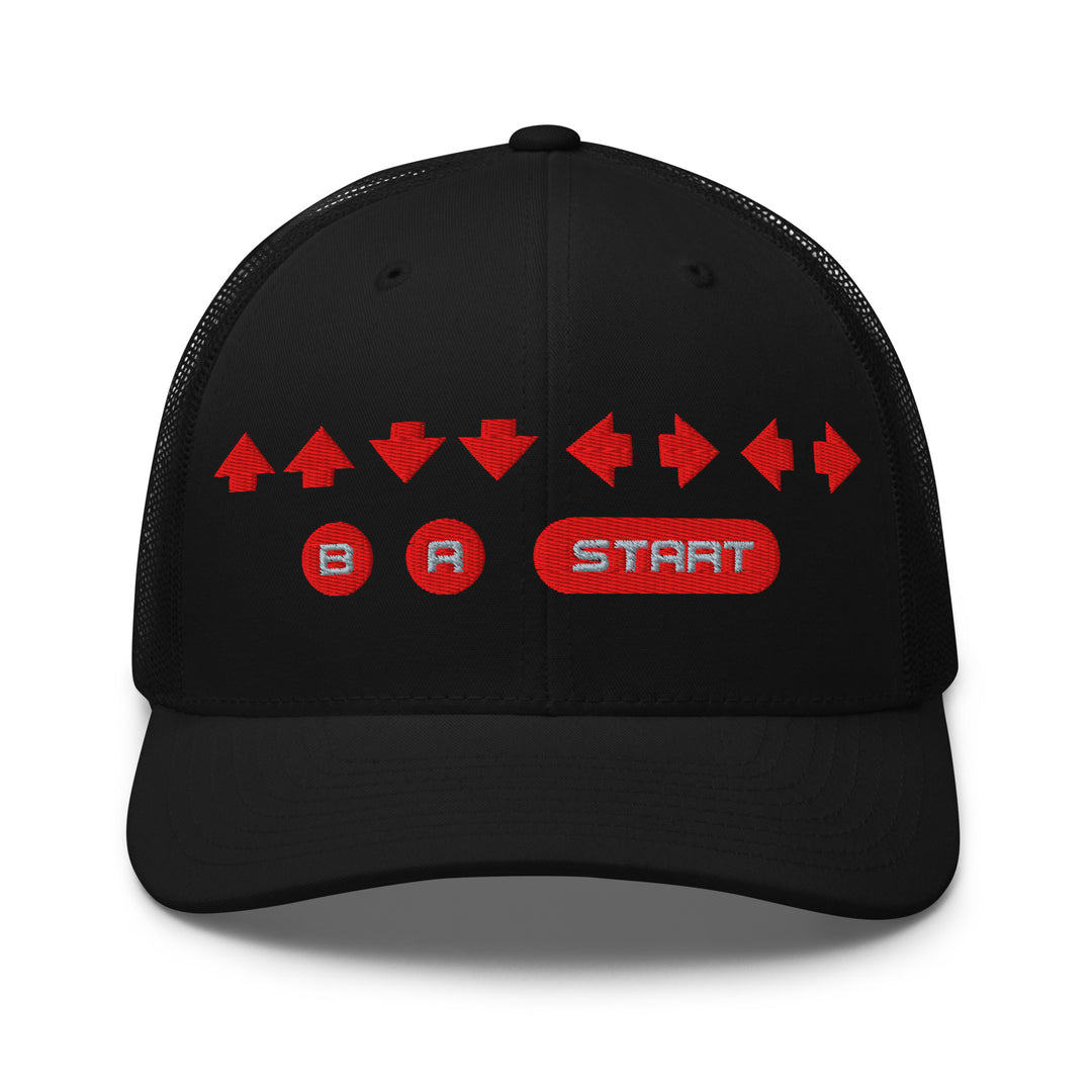 Front view of a black mesh trucker cap with red embroidered directional arrows and B A Start button symbols