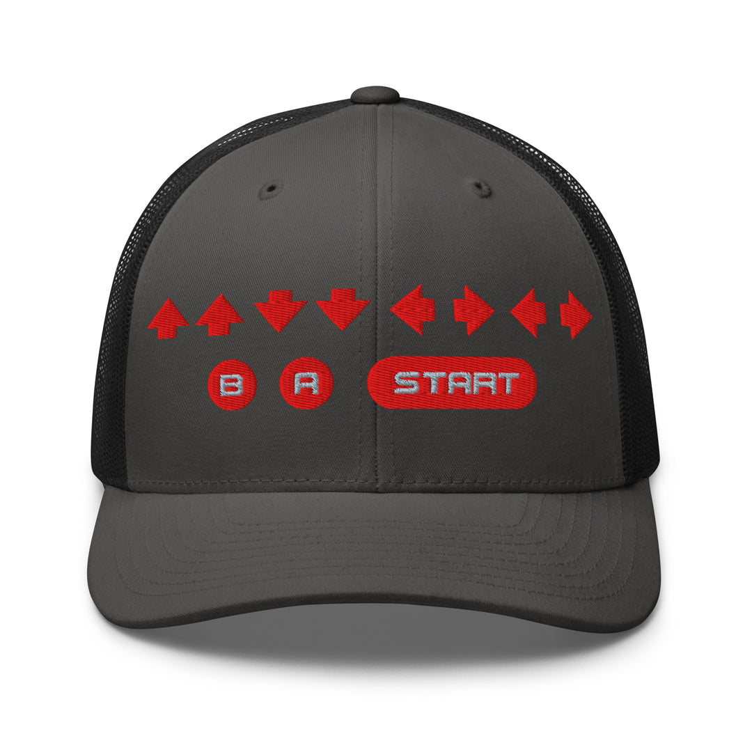 Front view of a charcoal gray and black mesh trucker cap with red embroidered directional arrows and B A Start button symbols