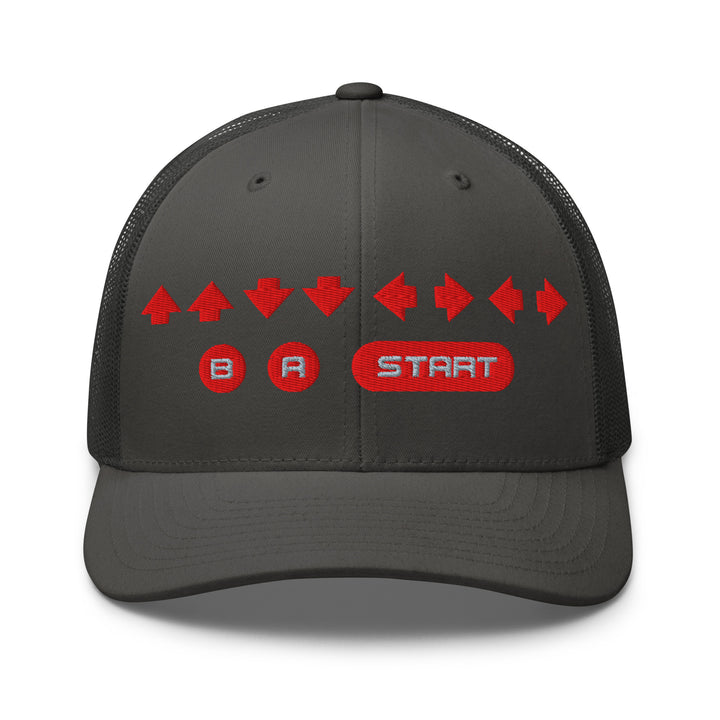 Front view of a charcoal gray mesh trucker cap with red embroidered directional arrows and B A Start button symbols