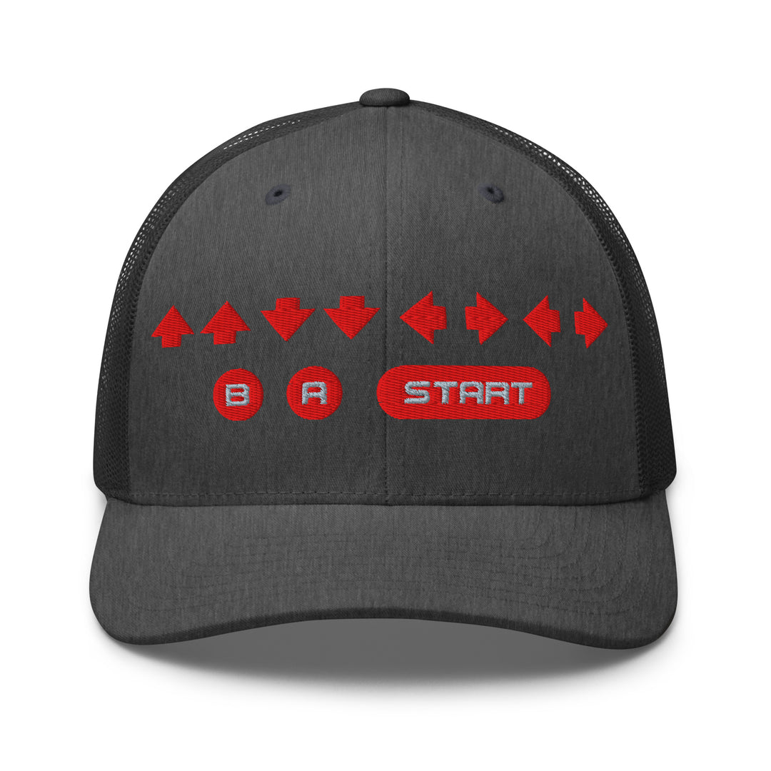 Front view of a dark heather gray trucker cap with red embroidered directional arrows and B A Start button symbols