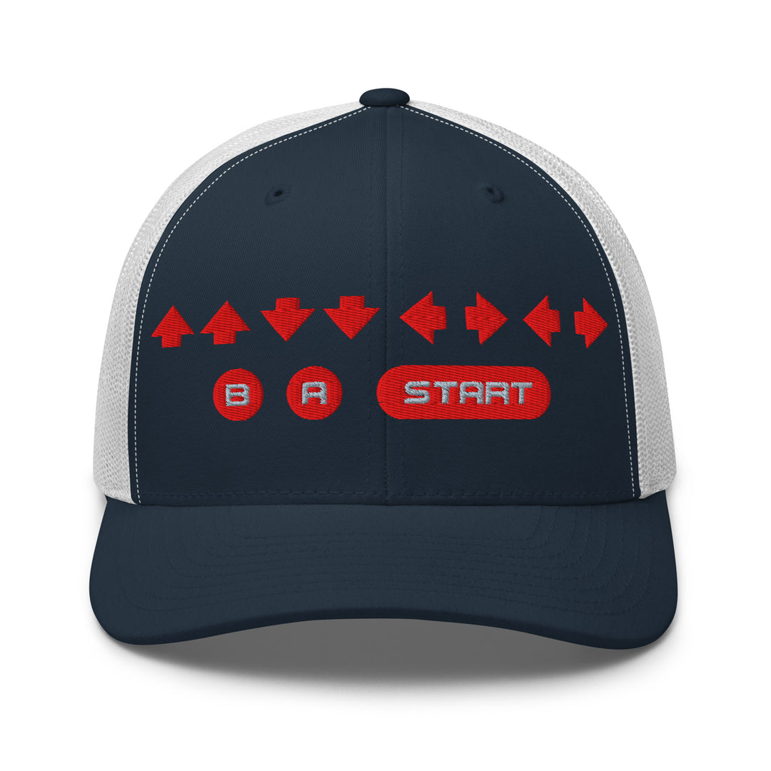 Front view of a navy and white mesh trucker cap with red embroidered directional arrows and B A Start button symbols