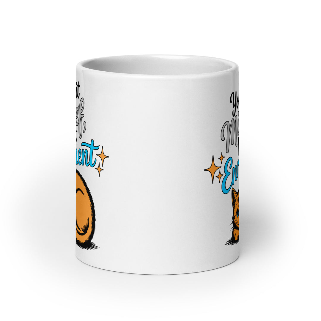 Left side view of the Keep It Geek “You Call It Mischief, I Call It Enrichment” orange cat glossy coffee mug, featuring bold typography with logo-matched blue accents and an illustrated orange cat resting beneath the phrase on a white ceramic mug.
