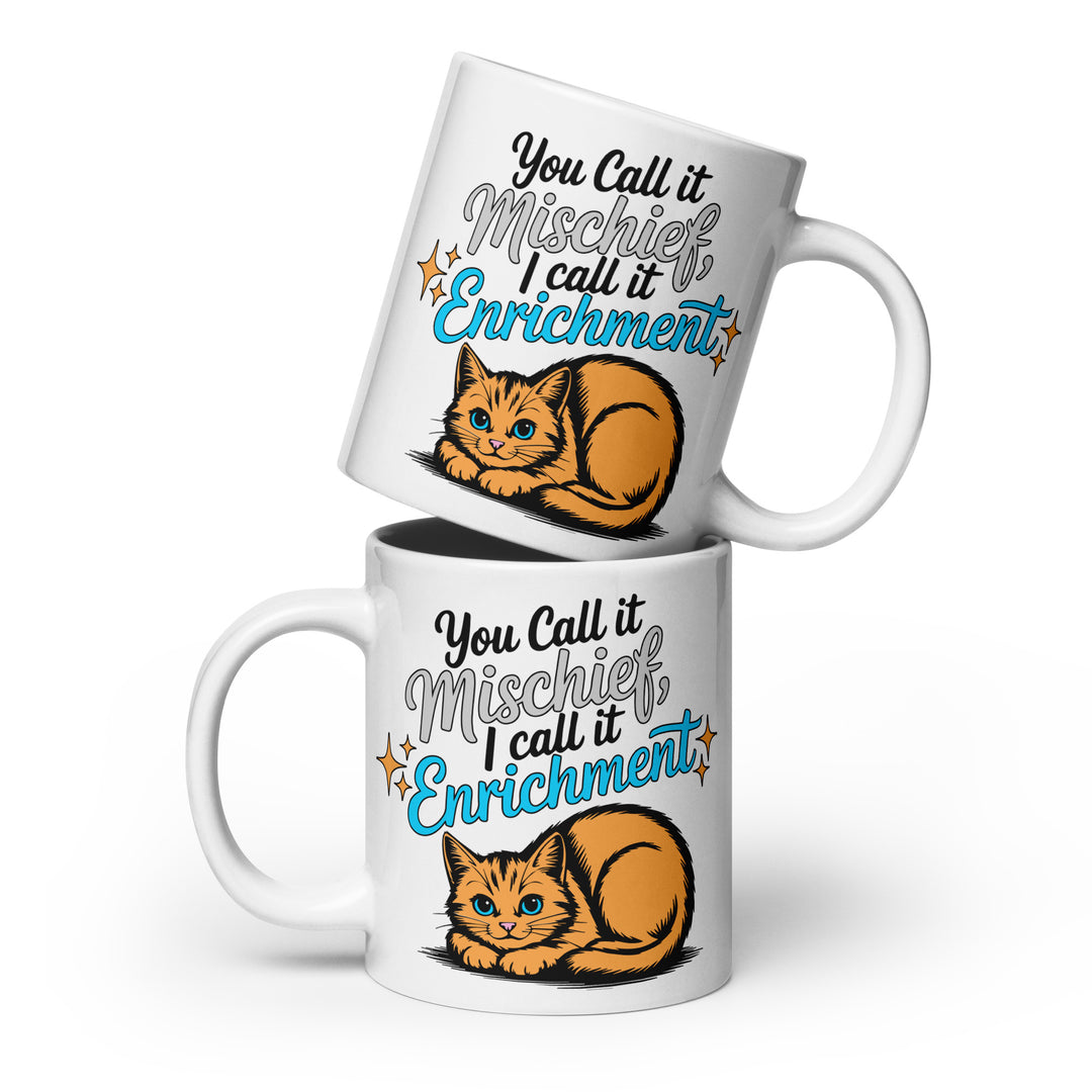 Stacked variant mockup showing both sides of the Keep It Geek “You Call It Mischief, I Call It Enrichment” orange cat glossy coffee mug in the 20 oz size, featuring logo-matched blue typography and an illustrated orange cat on a white ceramic mug.
