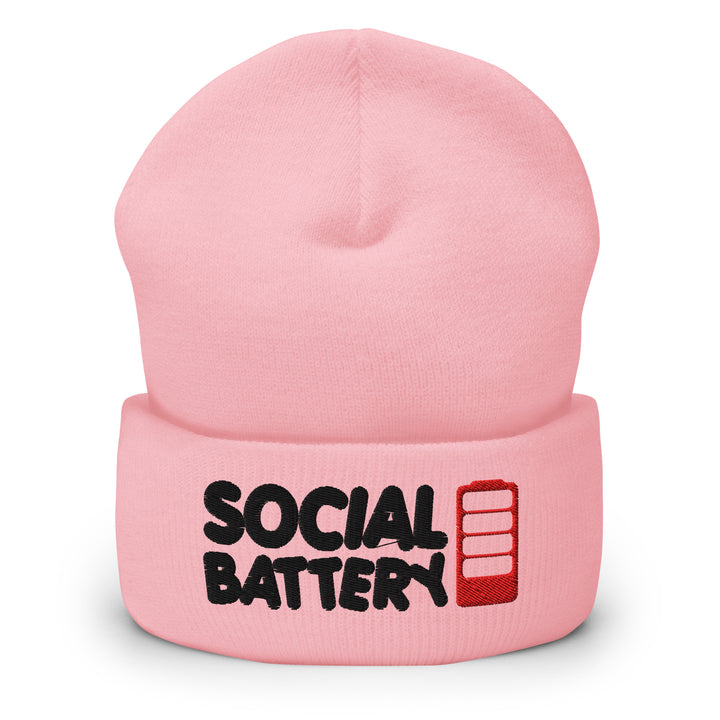 Pink cuffed beanie with “Social Battery” embroidery and a red low-battery icon, shown from the front.