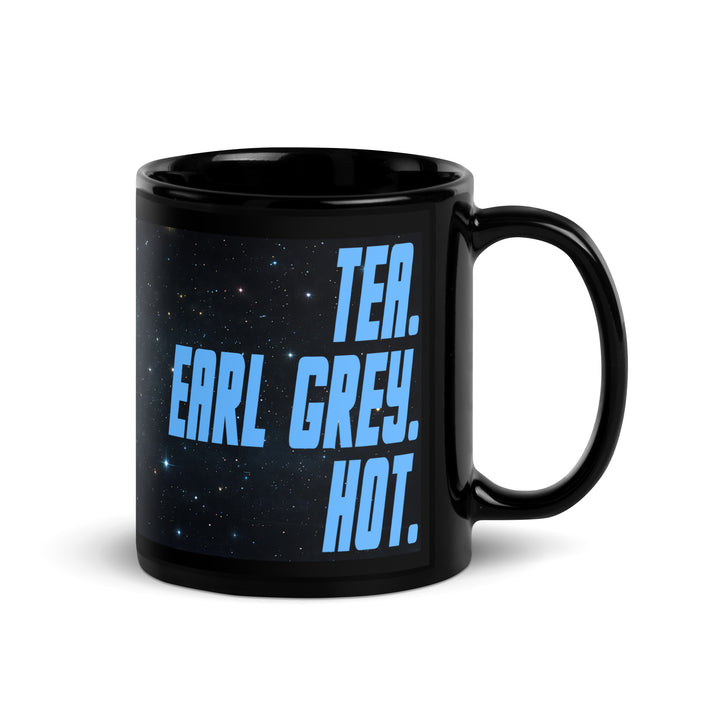 Black 11 oz glossy mug with “Tea. Earl Grey. Hot.” design shown from the right-handle angle.