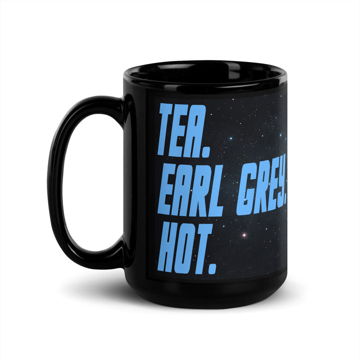 Black 15 oz glossy mug with “Tea. Earl Grey. Hot.” design shown from the left-handle angle.