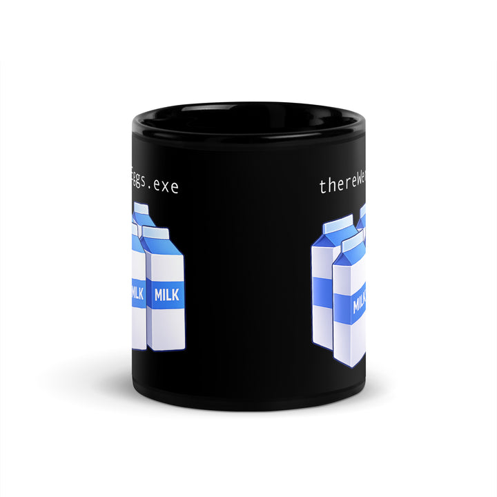 Front view of an 11 oz black ceramic mug featuring the “thereWereEggs.exe” design with six blue-and-white milk cartons in a clean, wraparound-style print.