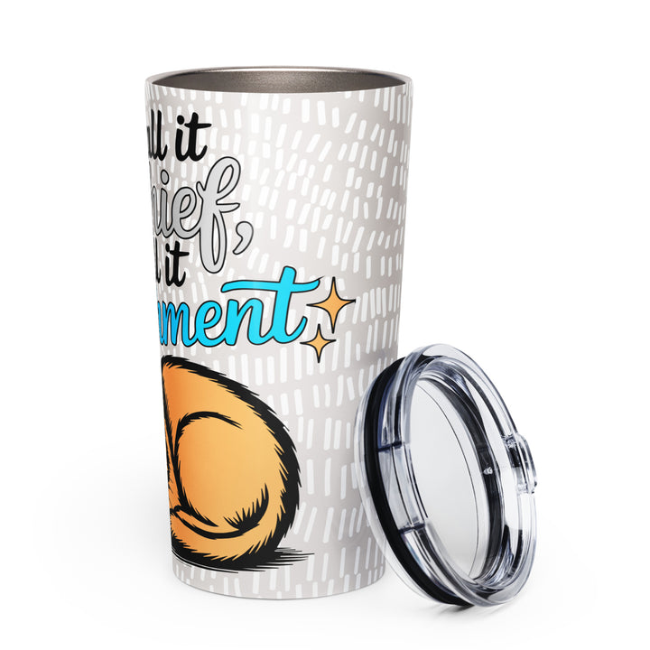 White 20 oz tapered stainless steel tumbler with “You Call it Mischief, I Call it Enrichment” orange cat design, shown from the left side.