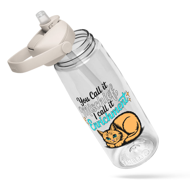 Clear Camelbak flip-straw water bottle with “You Call it Mischief, I Call it Enrichment” orange cat design, shown at an angled view with the lid open.